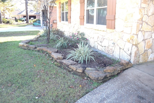 26 Westpoint Dr, Trinity, TX 75862 - view of property exterior with stone siding and a yard