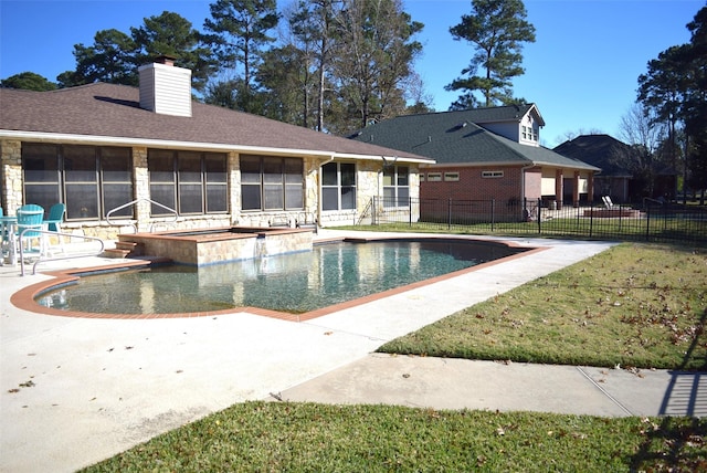 view of pool featuring a lawn and a patio