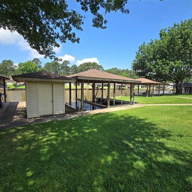 26 Westpoint Dr, Trinity, TX 75862 - surrounding community featuring boat lift, a lawn, and a dock