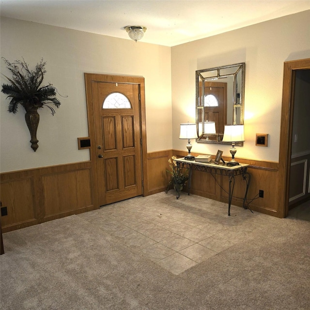 26 Westpoint Dr, Trinity, TX 75862 - entrance foyer featuring wainscoting, wooden walls, and light colored carpet