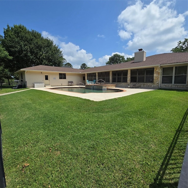 26 Westpoint Dr, Trinity, TX 75862 - back of house featuring a chimney, stone siding, a patio area, and an outdoor pool
