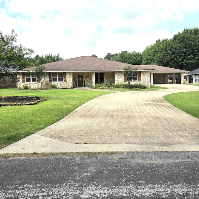 26 Westpoint Dr, Trinity, TX 75862 - single story home with stone siding, concrete driveway, an attached garage, and a front lawn