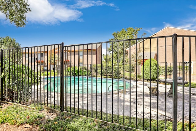 view of gate featuring a fenced in pool