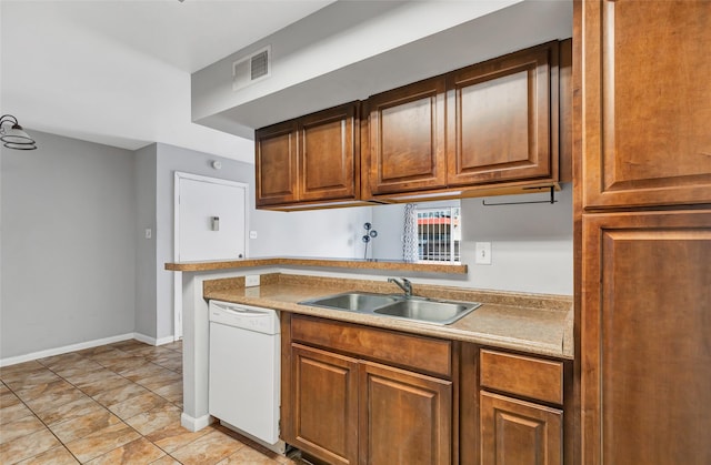 kitchen featuring dishwasher and sink