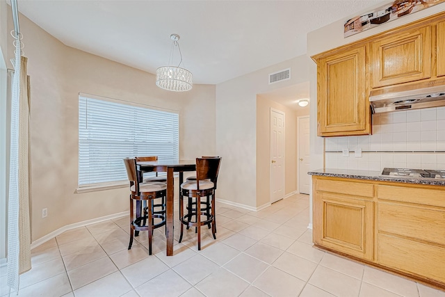 dining area with visible vents, baseboards, and light tile patterned floors