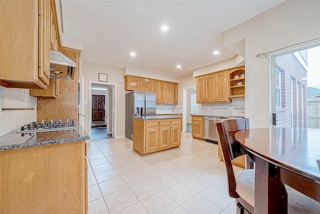 kitchen featuring light tile patterned floors, stainless steel appliances, backsplash, a center island, and open shelves