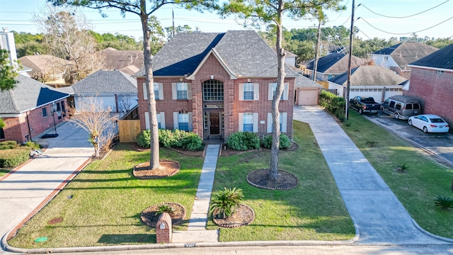 view of front of house featuring a residential view, brick siding, a front lawn, and roof with shingles