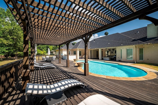 view of pool with a pergola and a deck