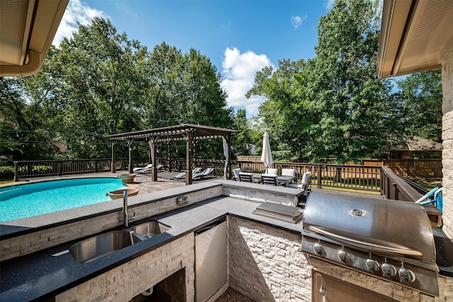 view of swimming pool with a grill, a pergola, and sink