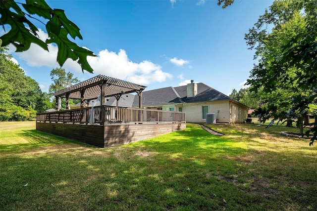 view of yard with a pergola and central AC