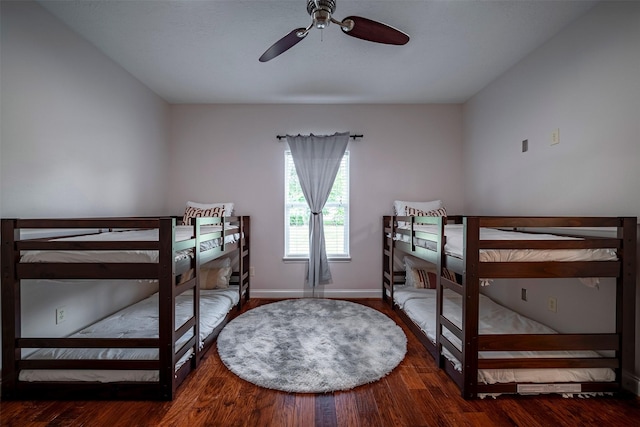 bedroom with wood-type flooring and ceiling fan