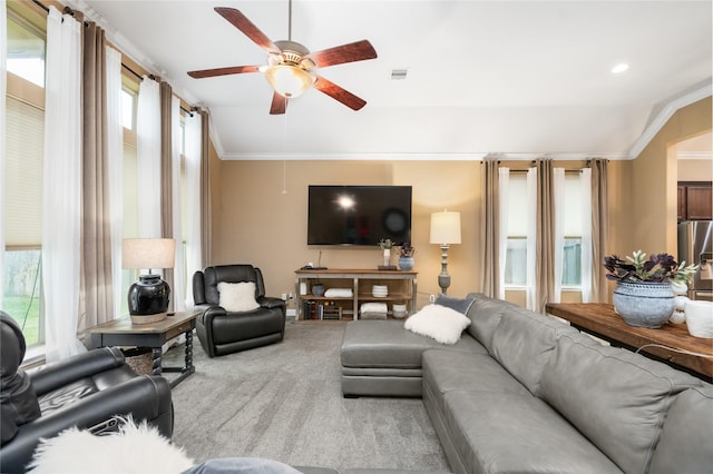 living room with ceiling fan, carpet floors, a healthy amount of sunlight, and vaulted ceiling