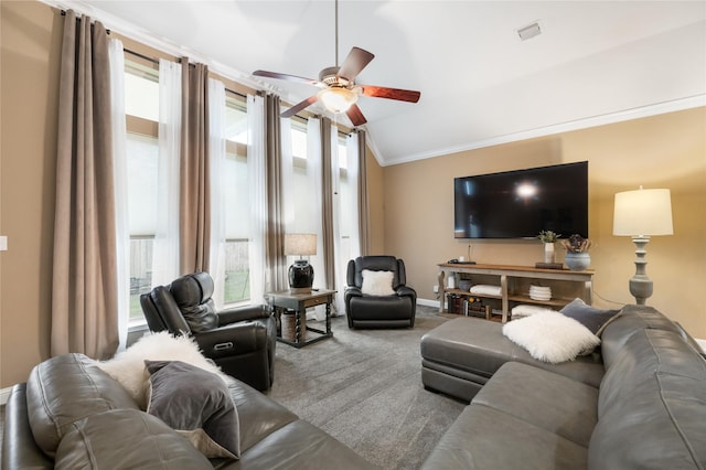 carpeted living room featuring vaulted ceiling, ceiling fan, and crown molding