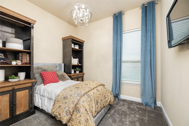 carpeted bedroom featuring a notable chandelier