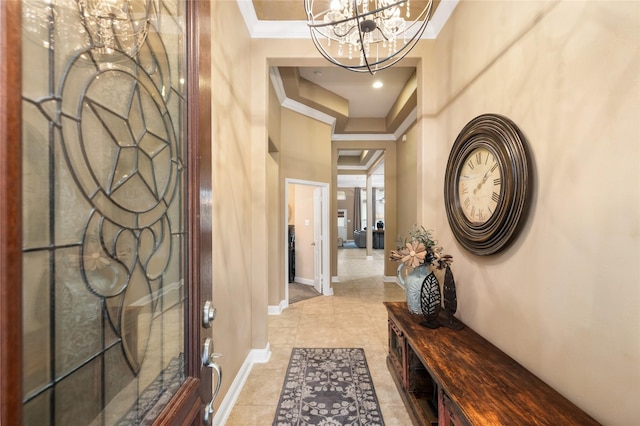 interior space with crown molding, a high ceiling, and an inviting chandelier