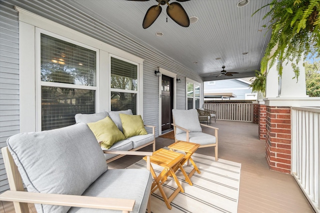 wooden deck with ceiling fan and covered porch