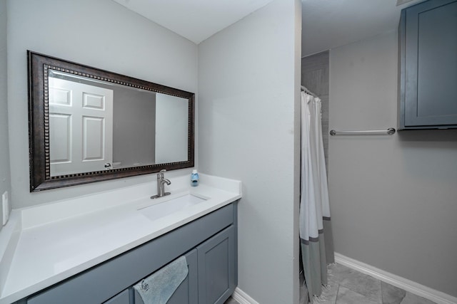 bathroom featuring a shower with shower curtain, vanity, and tile patterned flooring