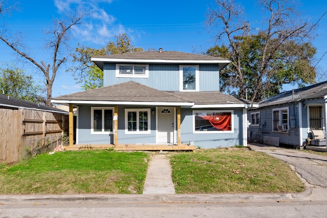 view of front of home featuring covered porch and a front yard