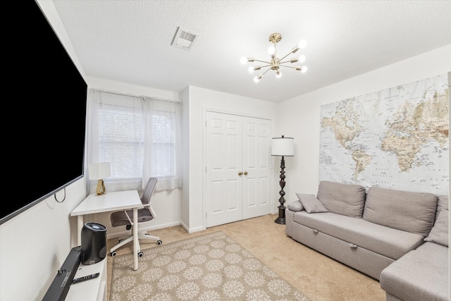 living room with light colored carpet, a textured ceiling, and a chandelier