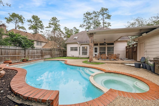 view of swimming pool featuring ceiling fan, an in ground hot tub, and a patio