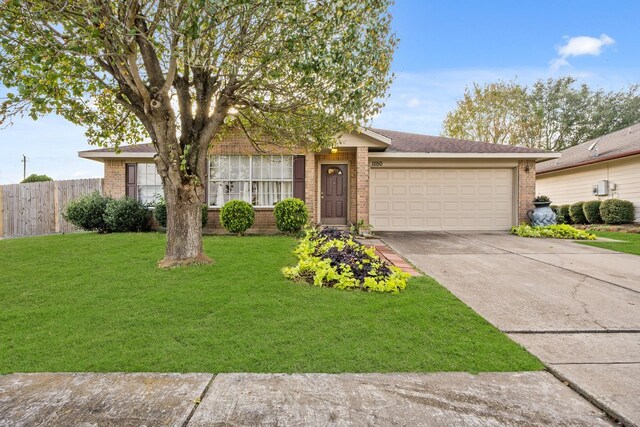 single story home with a garage and a front yard