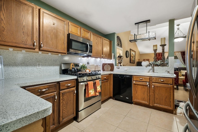 kitchen with sink, hanging light fixtures, tasteful backsplash, kitchen peninsula, and stainless steel appliances