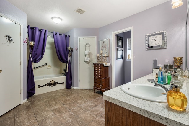 bathroom with shower / bath combination with curtain and vanity