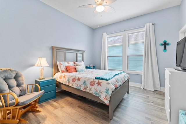 bedroom featuring ceiling fan and light hardwood / wood-style floors