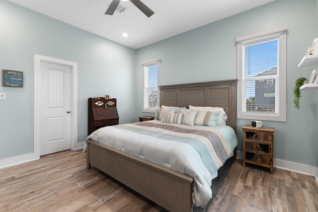 bedroom featuring ceiling fan and wood-type flooring