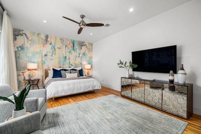 bedroom featuring ceiling fan and hardwood / wood-style flooring