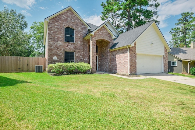 view of property with cooling unit, a front yard, and a garage