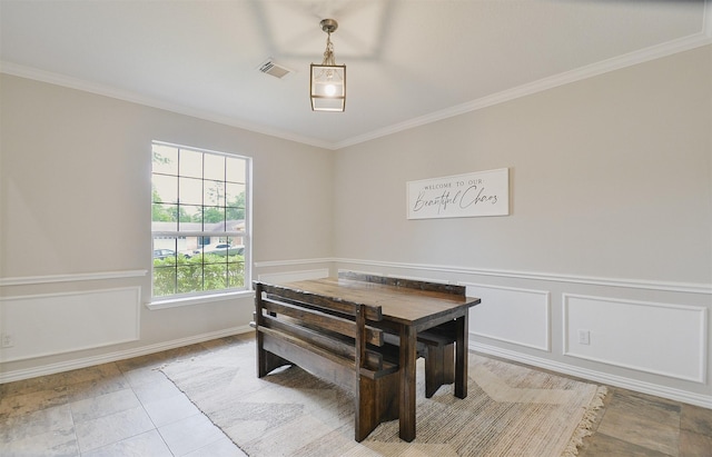 tiled dining area with crown molding