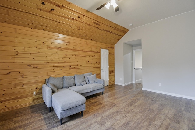 sitting room featuring wood-type flooring, ceiling fan, lofted ceiling, and wood walls