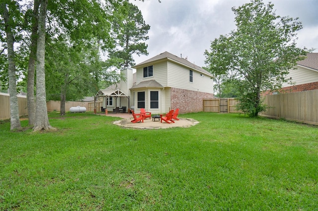 view of yard featuring a patio area and a fire pit