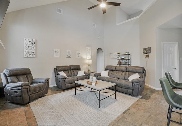 living room featuring high vaulted ceiling and ceiling fan