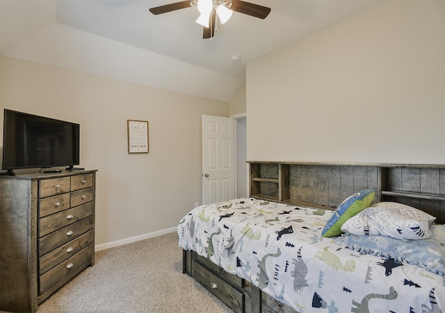 carpeted bedroom with ceiling fan and lofted ceiling