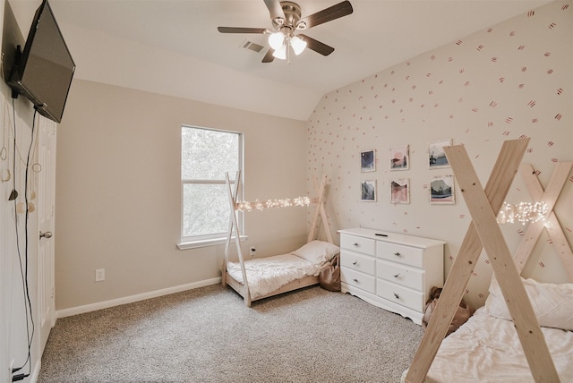 unfurnished bedroom featuring carpet, ceiling fan, and lofted ceiling