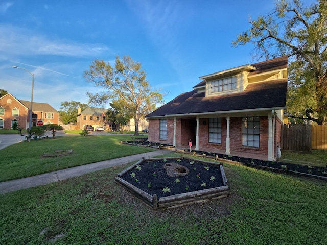 bungalow-style house featuring a front yard