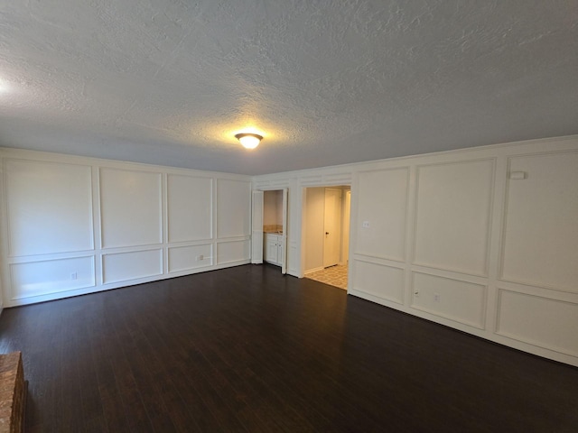 spare room featuring dark hardwood / wood-style floors