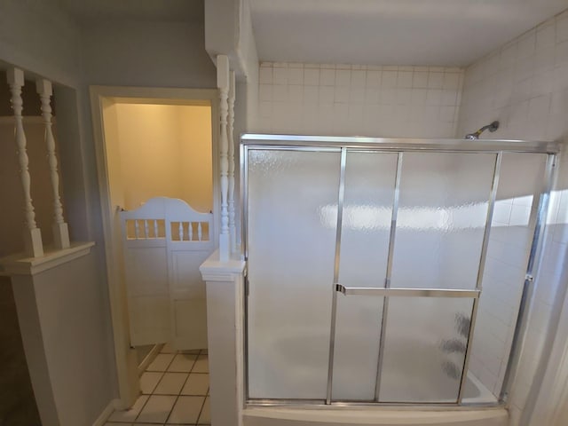 bathroom featuring tile patterned flooring and an enclosed shower