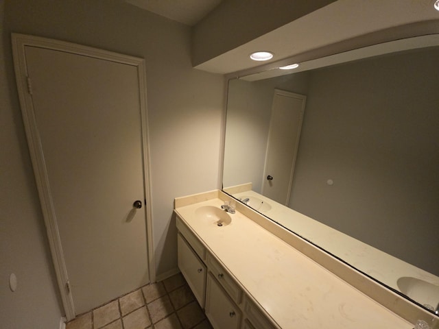 bathroom featuring tile patterned flooring and vanity