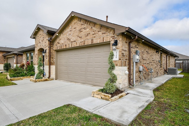 view of property exterior featuring a garage and central air condition unit