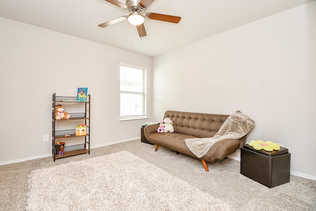 living area with carpet flooring and ceiling fan