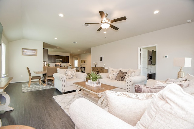 living room with lofted ceiling, ceiling fan, and dark hardwood / wood-style floors