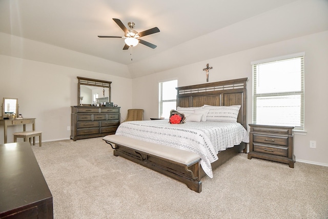 bedroom with ceiling fan, light carpet, and lofted ceiling