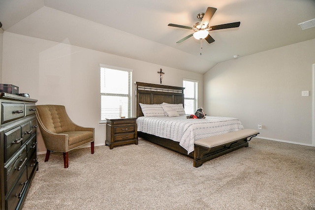 bedroom featuring ceiling fan, lofted ceiling, and light carpet