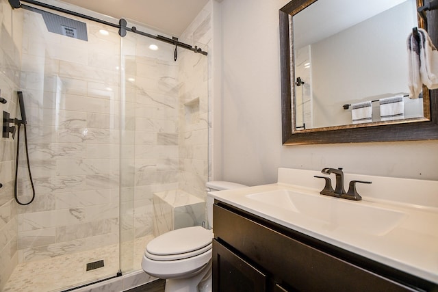 bathroom with vanity, toilet, and walk in shower