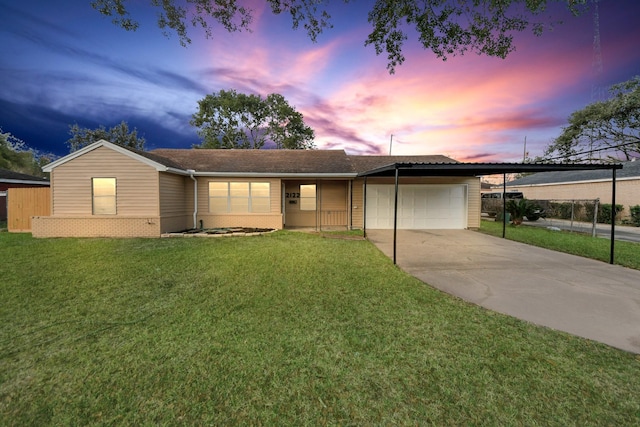 ranch-style house with a yard, a garage, and a carport