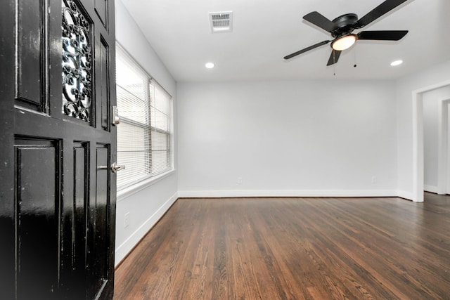 unfurnished room featuring ceiling fan and dark hardwood / wood-style floors