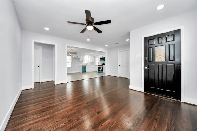 entryway with ceiling fan and dark hardwood / wood-style flooring